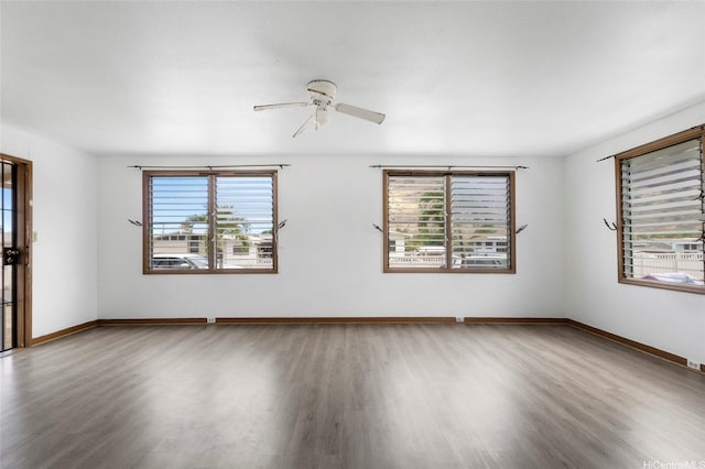 84-570 Farrington Hwy Unit D, Waianae, HI 96792 - spare room with healthy amount of natural light, wood finished floors, and a ceiling fan