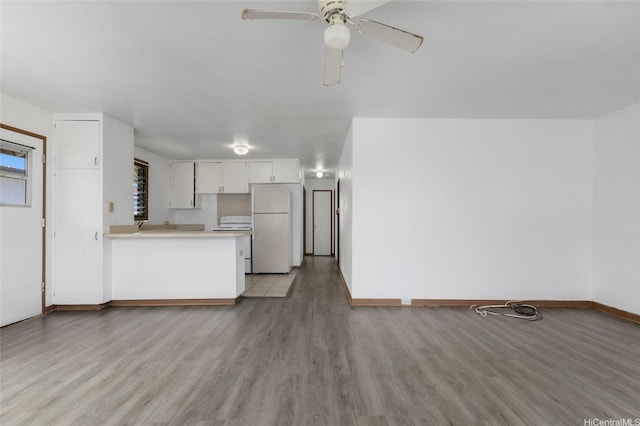 84-570 Farrington Hwy Unit D, Waianae, HI 96792 - unfurnished living room with light wood finished floors and ceiling fan