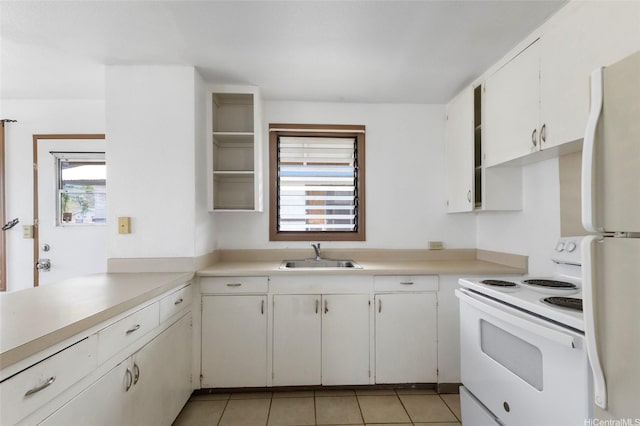 84-570 Farrington Hwy Unit D, Waianae, HI 96792 - kitchen with white appliances, light countertops, white cabinetry, and light tile patterned flooring