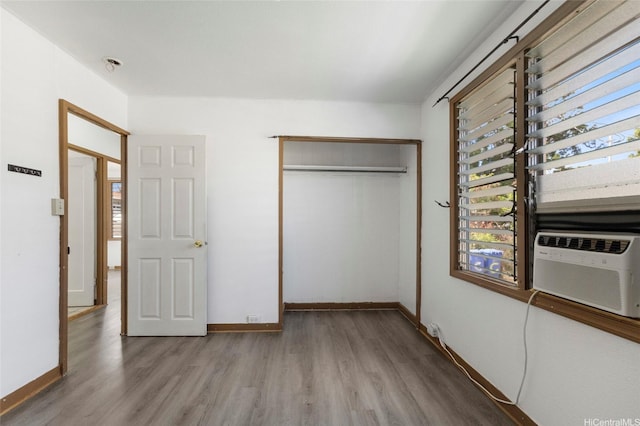 84-570 Farrington Hwy Unit D, Waianae, HI 96792 - unfurnished bedroom featuring wood finished floors and a closet