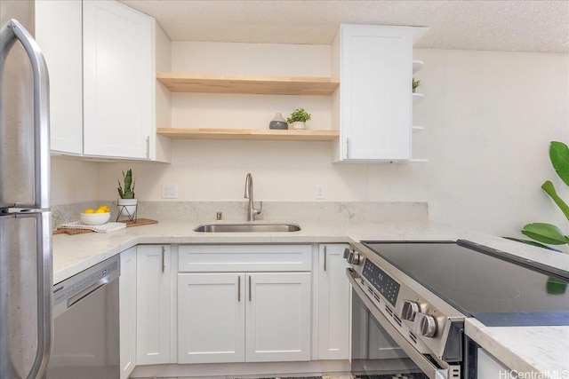 300 Wai Nani Way Unit 1715, Honolulu, HI 96815 - kitchen featuring appliances with stainless steel finishes, open shelves, white cabinets, light stone counters, and a textured ceiling