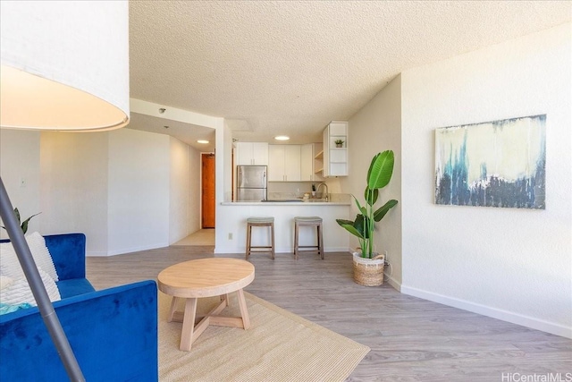 300 Wai Nani Way Unit 1715, Honolulu, HI 96815 - living area featuring a textured ceiling, light wood finished floors, and recessed lighting