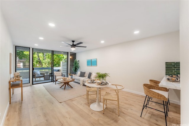 333 Aoloa St Unit 214, Kailua, HI 96734 - living area featuring floor to ceiling windows, recessed lighting, ceiling fan, and light wood-type flooring