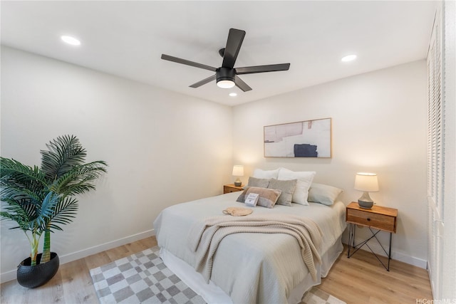 333 Aoloa St Unit 214, Kailua, HI 96734 - bedroom with light wood-type flooring, recessed lighting, and a ceiling fan
