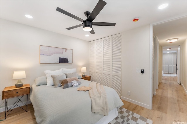 333 Aoloa St Unit 214, Kailua, HI 96734 - bedroom featuring light wood-type flooring, a closet, recessed lighting, and a ceiling fan