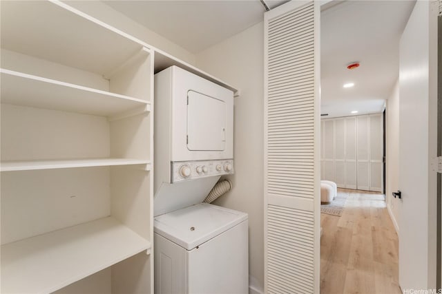 333 Aoloa St Unit 214, Kailua, HI 96734 - laundry area with stacked washer / drying machine, light wood-style floors, and recessed lighting