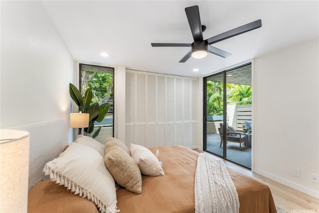 333 Aoloa St Unit 214, Kailua, HI 96734 - bedroom with access to outside, a wall of windows, light wood-style flooring, recessed lighting, and a ceiling fan