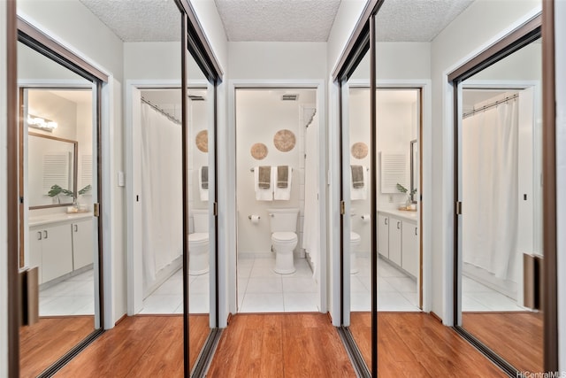 46-036 Aliikane Pl Unit 522, Kaneohe, HI 96744 - corridor with light wood-style flooring and a textured ceiling