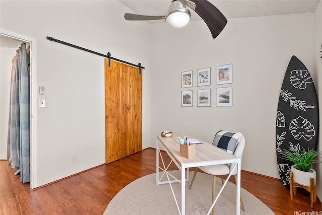 46-036 Aliikane Pl Unit 522, Kaneohe, HI 96744 - office area with a ceiling fan, a barn door, wood finished floors, and beamed ceiling