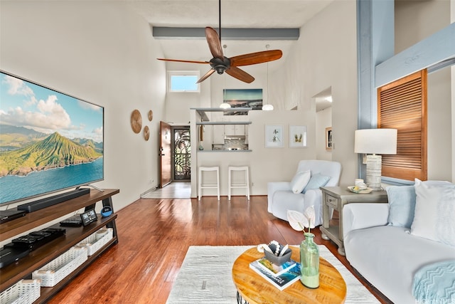 46-036 Aliikane Pl Unit 522, Kaneohe, HI 96744 - living room featuring high vaulted ceiling, ceiling fan, wood finished floors, and beam ceiling