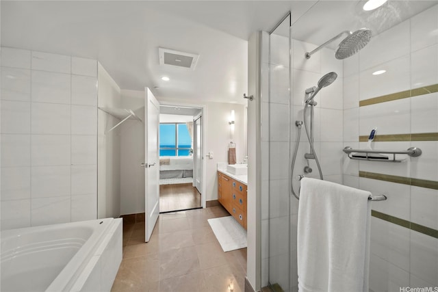 1177 Queen St Unit 4104, Honolulu, HI 96814 - ensuite bathroom featuring tiled shower, vanity, a bathtub, and recessed lighting