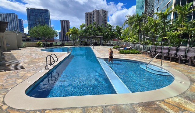 1177 Queen St Unit 4104, Honolulu, HI 96814 - community pool featuring a patio area and a city view