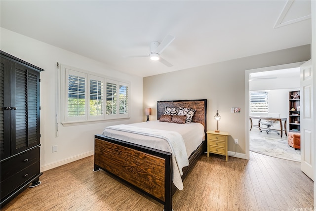 539 N Kainalu Dr, Kailua, HI 96734 - bedroom with light wood-type flooring, a desk, and a ceiling fan