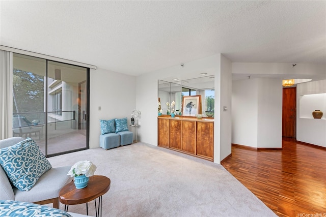 1525 Wilder Ave Unit 401, Honolulu, HI 96822 - living area featuring plenty of natural light, wood finished floors, and a textured ceiling