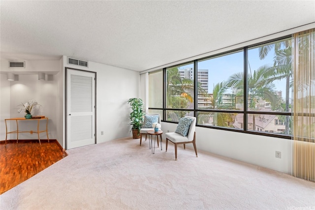 1525 Wilder Ave Unit 401, Honolulu, HI 96822 - living area with carpet and a textured ceiling