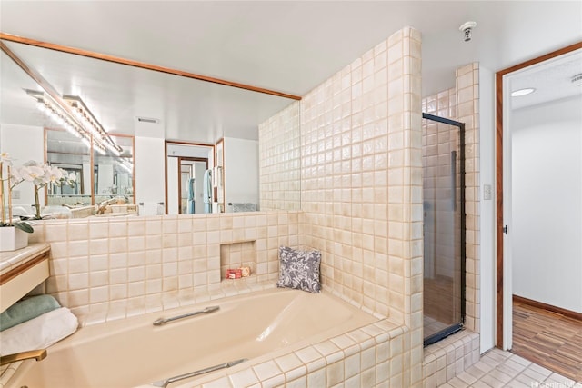 1525 Wilder Ave Unit 401, Honolulu, HI 96822 - bathroom featuring a garden tub, a stall shower, and tile patterned flooring