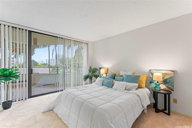 1525 Wilder Ave Unit 401, Honolulu, HI 96822 - bedroom with carpet, access to exterior, expansive windows, and a textured ceiling