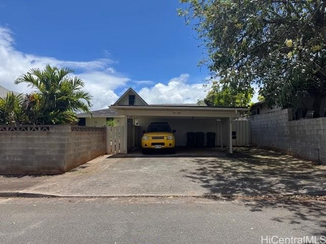 95-595 Naholoholo St, Mililani, HI 96789 - garage with asphalt driveway and an attached carport
