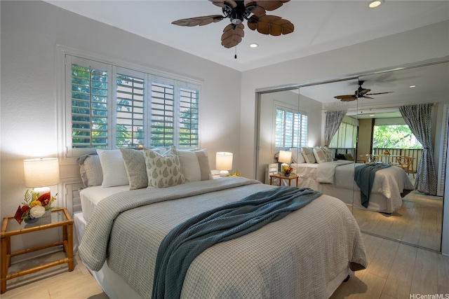 3721 Kanaina Ave Unit 201, Honolulu, HI 96815 - bedroom with light wood finished floors, multiple windows, a ceiling fan, and recessed lighting