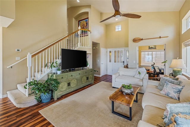 92-6024 Kohi St, Kapolei, HI 96707 - living area featuring stairway, a towering ceiling, wood finished floors, a ceiling fan, and healthy amount of natural light