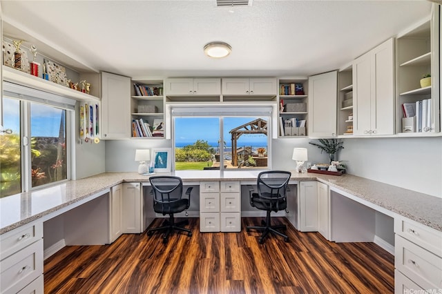 92-6024 Kohi St, Kapolei, HI 96707 - home office with built in desk and dark wood finished floors