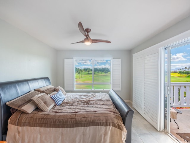 91-1058 Kekuilani Loop Unit 1508, Kapolei, HI 96707 - bedroom featuring ceiling fan and view of golf course