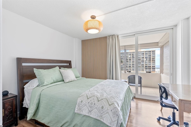 1720 Ala Moana Blvd Unit 1101B, Honolulu, HI 96815 - bedroom featuring wood finished floors and access to outside