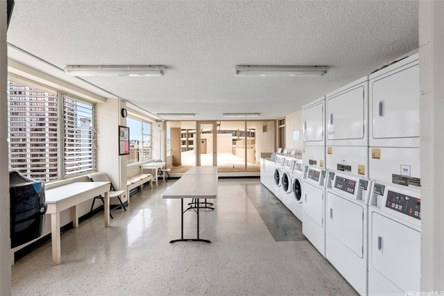1720 Ala Moana Blvd Unit 1101B, Honolulu, HI 96815 - community laundry room featuring stacked washer and clothes dryer and a textured ceiling