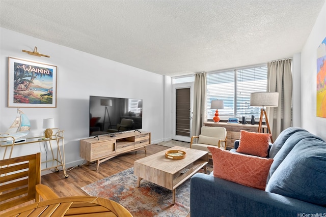 1720 Ala Moana Blvd Unit 1101B, Honolulu, HI 96815 - living area featuring wood finished floors and a textured ceiling