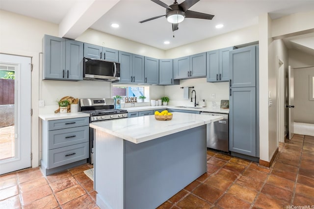 54-290 Kawaipuna Pl, Hauula, HI 96717 - kitchen featuring appliances with stainless steel finishes, plenty of natural light, a center island, a ceiling fan, and recessed lighting