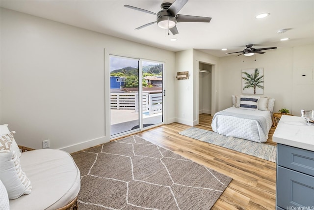 54-290 Kawaipuna Pl, Hauula, HI 96717 - bedroom with access to exterior, wood finished floors, recessed lighting, ceiling fan, and a closet