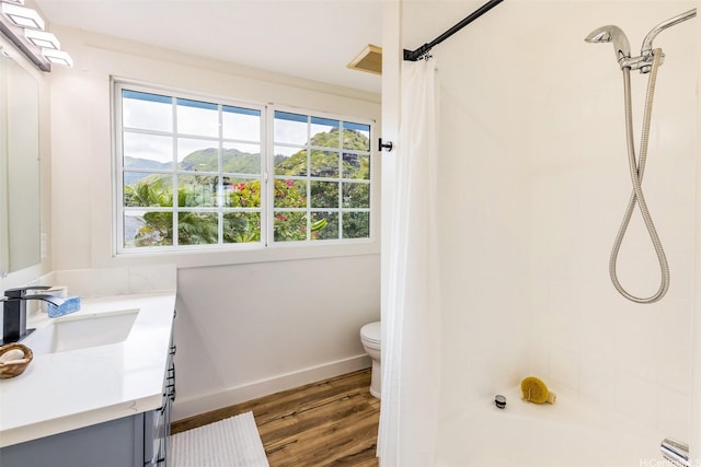 54-290 Kawaipuna Pl, Hauula, HI 96717 - full bath with wood finished floors, vanity, tiled shower, and a mountain view