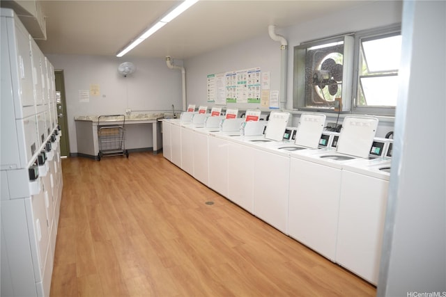 98-1038 Moanalua Rd Unit 7-1706, Aiea, HI 96701 - community laundry room with stacked washer / dryer, washing machine and dryer, and light wood finished floors