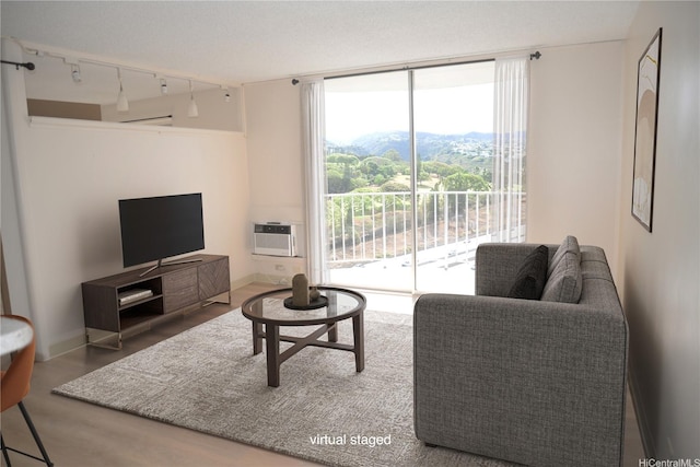 98-1038 Moanalua Rd Unit 7-1706, Aiea, HI 96701 - living room with wood finished floors, track lighting, floor to ceiling windows, and a wall mounted AC