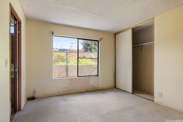 1918 Hawane Pl, Honolulu, HI 96821 - unfurnished bedroom featuring carpet flooring, a closet, and a textured ceiling