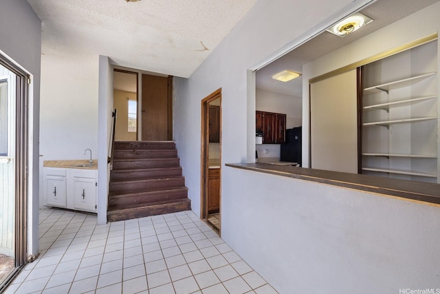 1918 Hawane Pl, Honolulu, HI 96821 - staircase with tile patterned flooring and a textured ceiling