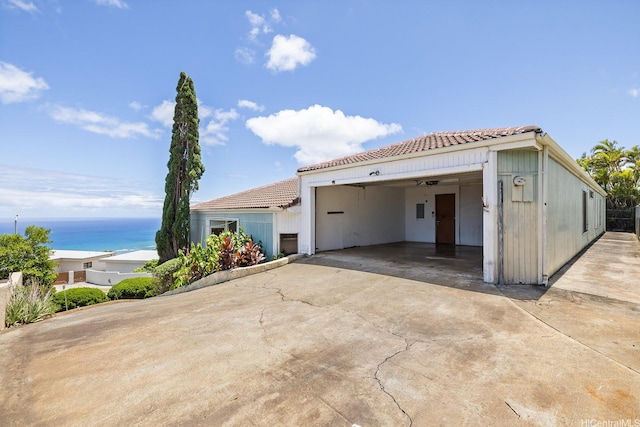 1918 Hawane Pl, Honolulu, HI 96821 - view of front of property with a tile roof, concrete driveway, and a water view