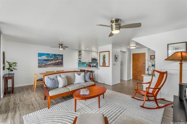 46-109 Konohiki St Unit 3934, Kaneohe, HI 96744 - living room featuring ceiling fan and light wood-style flooring