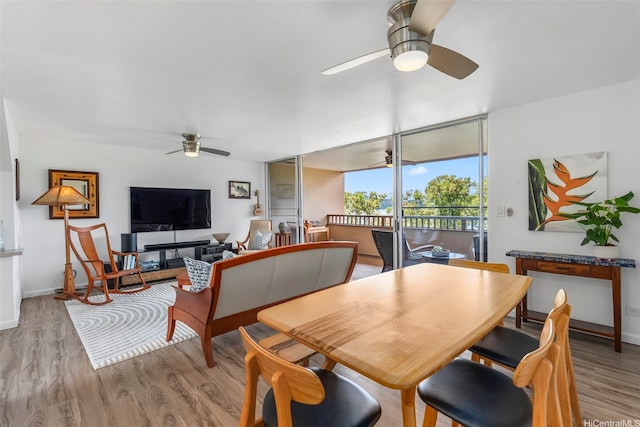 46-109 Konohiki St Unit 3934, Kaneohe, HI 96744 - dining area with ceiling fan, light wood finished floors, and expansive windows