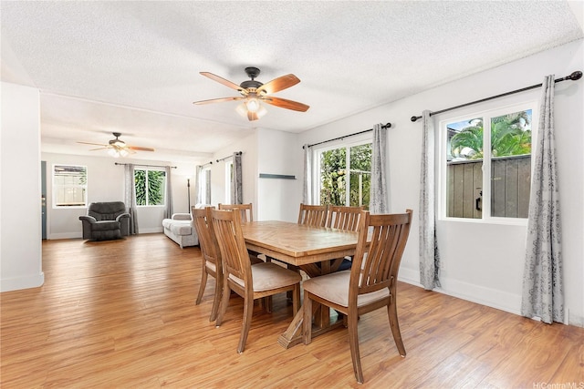 94-170 Apele Pl, Mililani, HI 96789 - dining space with light wood-style flooring, plenty of natural light, ceiling fan, and a textured ceiling