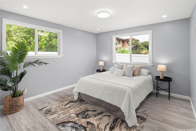 1989 9th Ave, Honolulu, HI 96816 - bedroom featuring multiple windows, light wood-style floors, and recessed lighting