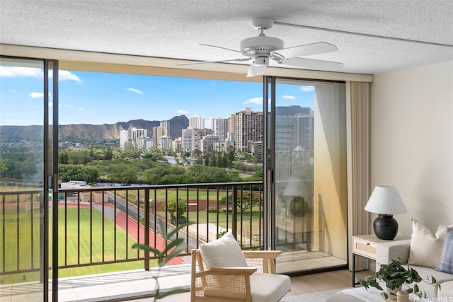 2444 Hihiwai St Unit 902, Honolulu, HI 96826 - balcony featuring ceiling fan, a view of city, and a mountain view