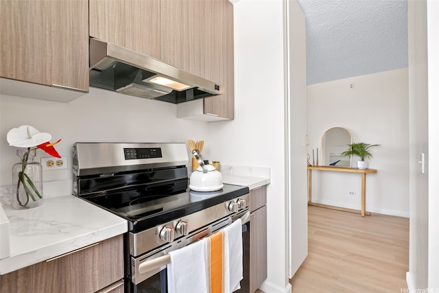 2444 Hihiwai St Unit 902, Honolulu, HI 96826 - kitchen featuring stainless steel range with electric cooktop, extractor fan, modern cabinets, and light wood-style flooring