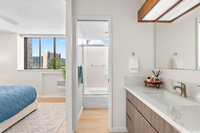 2444 Hihiwai St Unit 902, Honolulu, HI 96826 - full bathroom with wood finished floors, vanity, and bathtub / shower combination