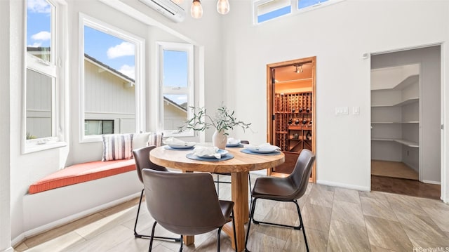 1373 Kaeleku St, Honolulu, HI 96825 - dining space featuring a wall unit AC and built in shelves