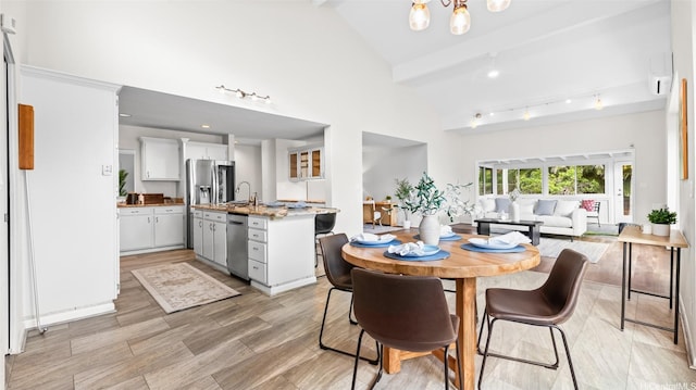1373 Kaeleku St, Honolulu, HI 96825 - dining room featuring high vaulted ceiling, beamed ceiling, and a chandelier