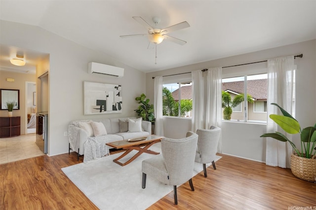 92-1487-A Aliinui Dr Unit 27A, Kapolei, HI 96707 - living area with a wall mounted air conditioner, lofted ceiling, light wood-style floors, and ceiling fan