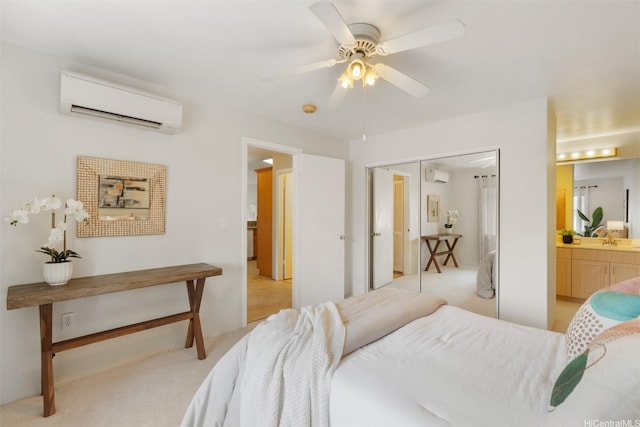 92-1487-A Aliinui Dr Unit 27A, Kapolei, HI 96707 - bedroom with a wall mounted air conditioner, light carpet, connected bathroom, a ceiling fan, and a closet
