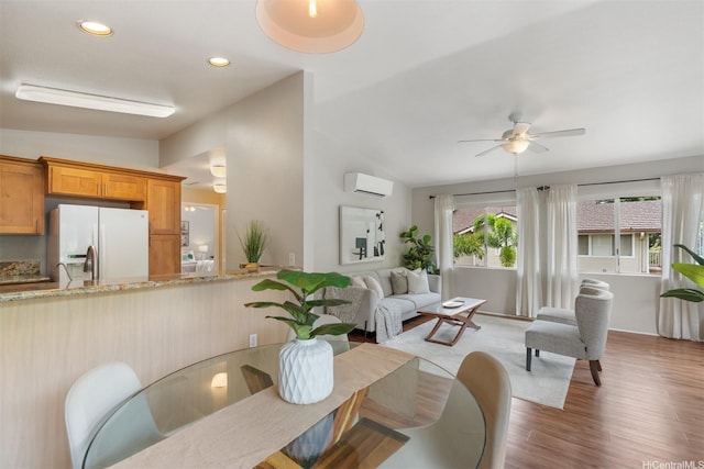 92-1487-A Aliinui Dr Unit 27A, Kapolei, HI 96707 - dining area with a wall mounted air conditioner, a ceiling fan, wood finished floors, lofted ceiling, and washer / clothes dryer