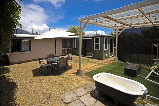 45-234 Mahalani Cir, Kaneohe, HI 96744 - view of grassy yard featuring a pergola and an outdoor fire pit